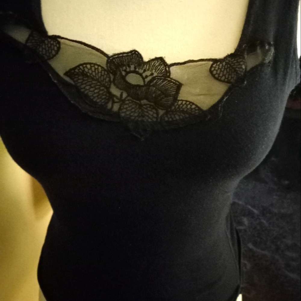 Used,not new black stretch camisole with decorative lace detail.